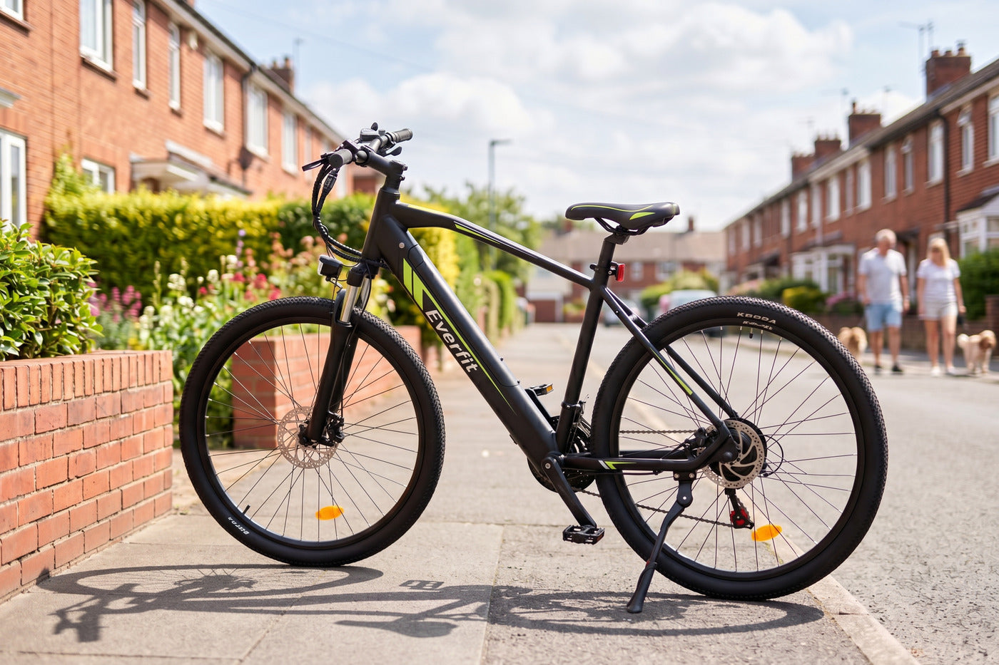 Black Everfit mountain electric bike on a sunny British red-brick terraced street