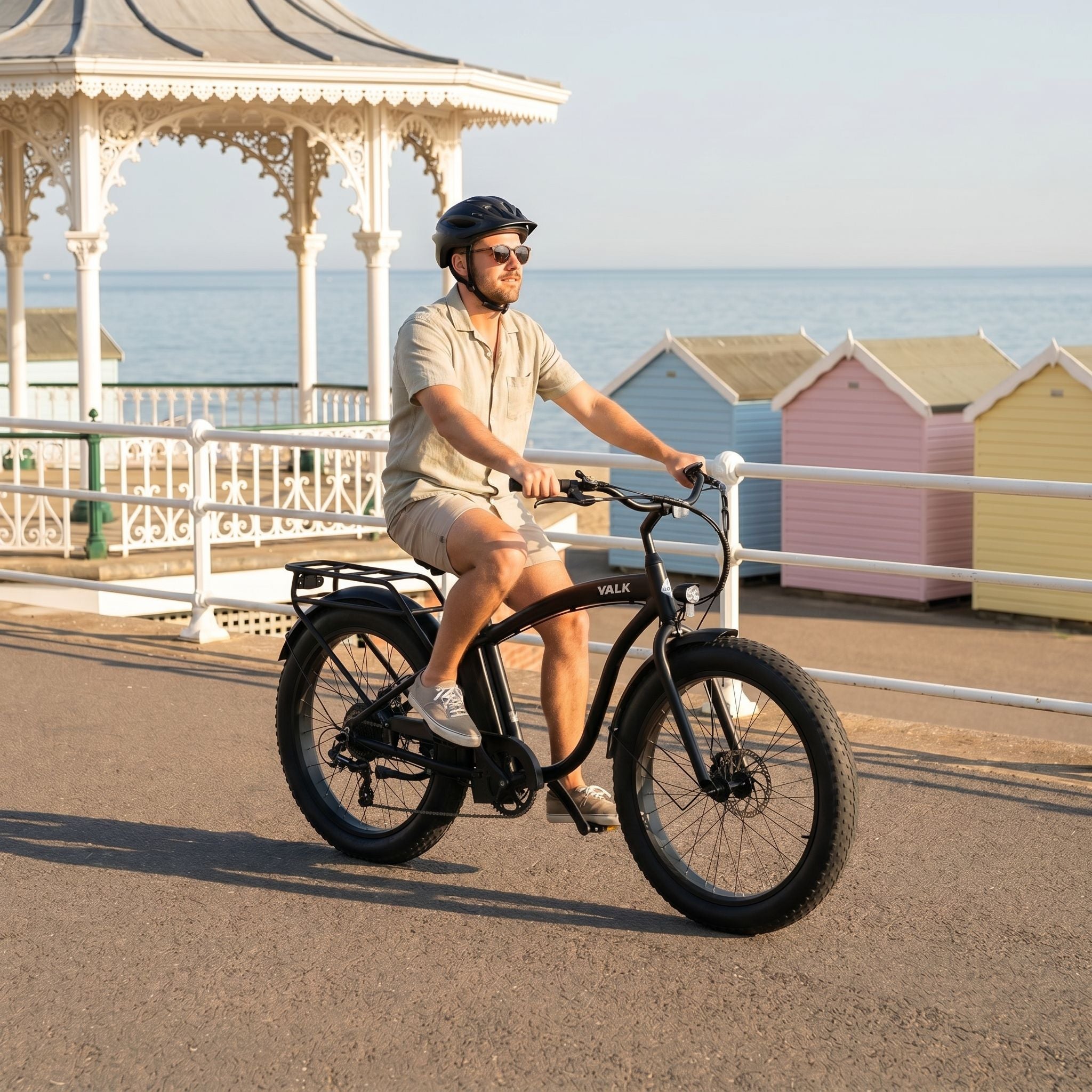 Men's e-bike — rider on a British coastal promenade